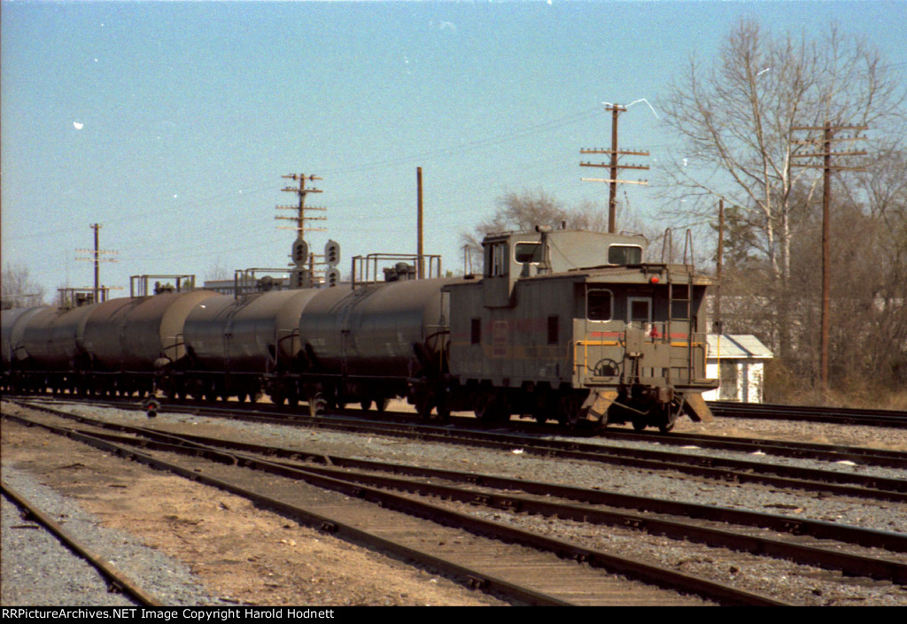 SCL 1162 brings up the rear of a train headed out of the yard 